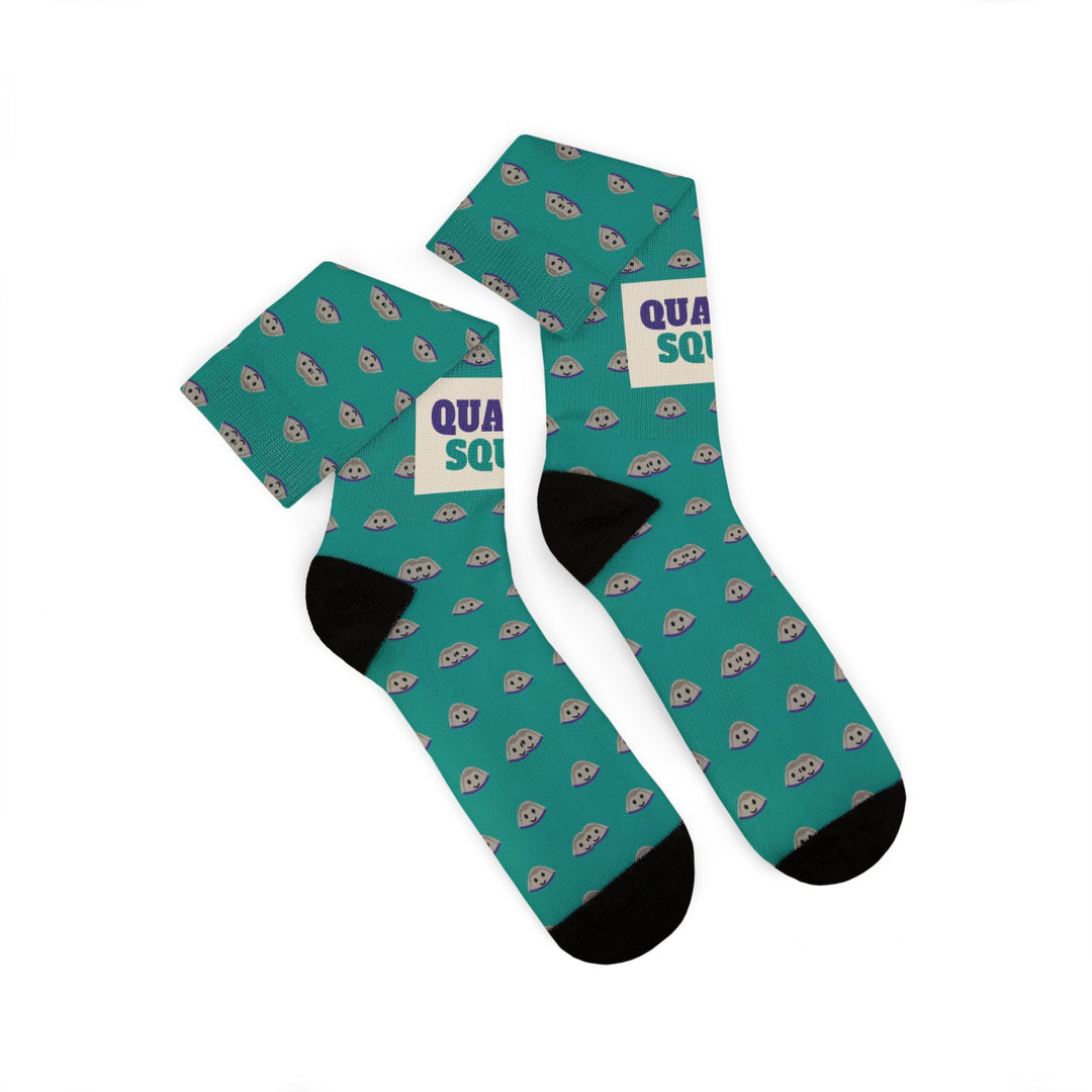 Two Quahog Squad socks folded and overlapping, black heels and toes on a teal clam shell pattern, Rhode Island socks