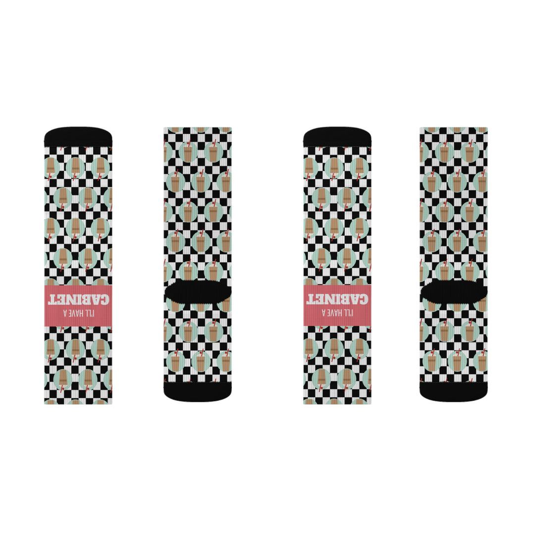 Third flat lay of I'll Have a Cabinet coffee cabinet socks, four socks side by side with black toes and coral bands