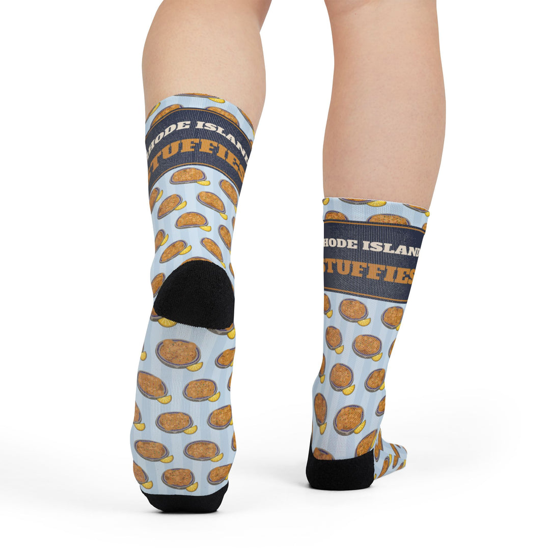 Front view of a model in Stuff It. funny beach socks with the navy cuff band and black toes