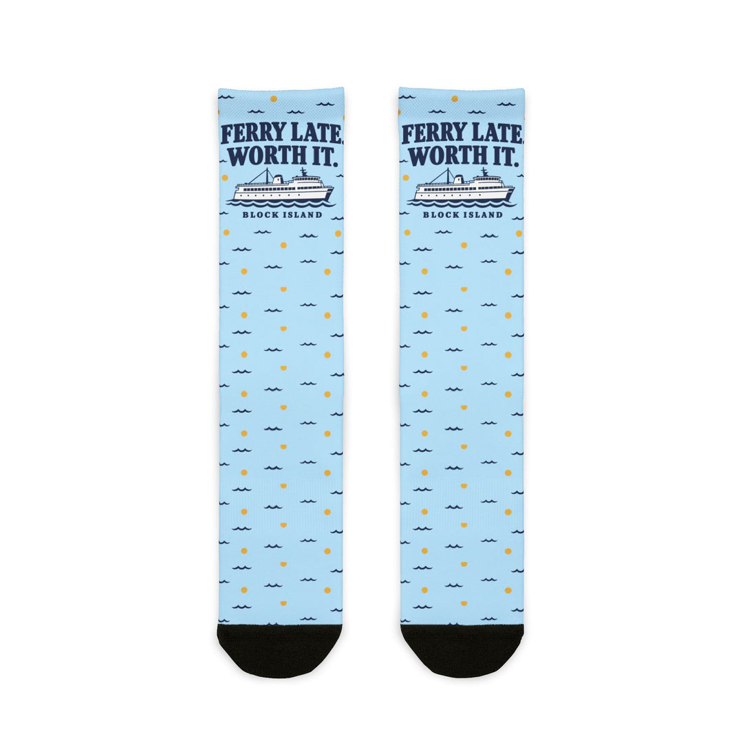 Ferry Late. Worth It. Block Island socks laid flat: light blue crew socks with navy ferry graphic and black heel and toe