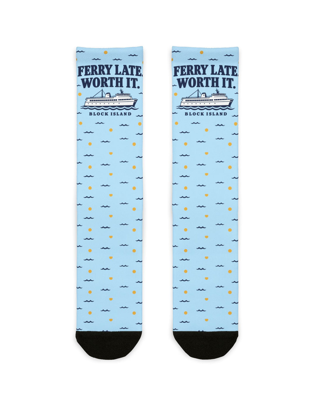 Ferry Late. Worth It. Block Island socks laid flat: light blue crew socks with navy ferry graphic and black heel and toe