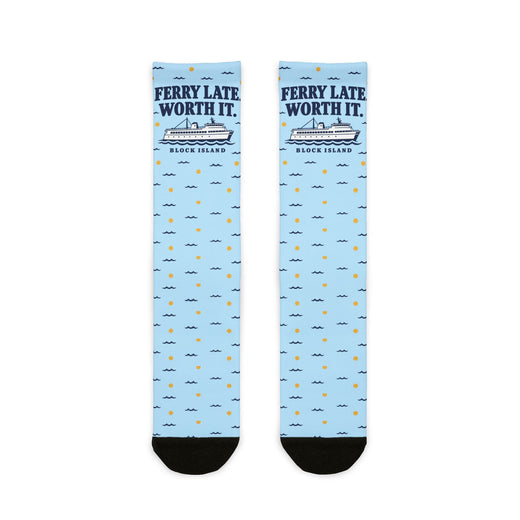 Ferry Late. Worth It. Block Island socks laid flat: light blue crew socks with navy ferry graphic and black heel and toe