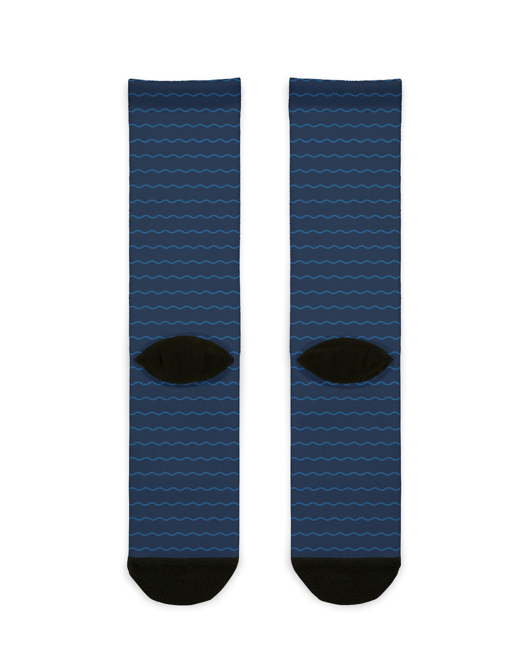 Back of the On Island Time nautical crew socks showing the navy wave pattern and black heels, flat lay