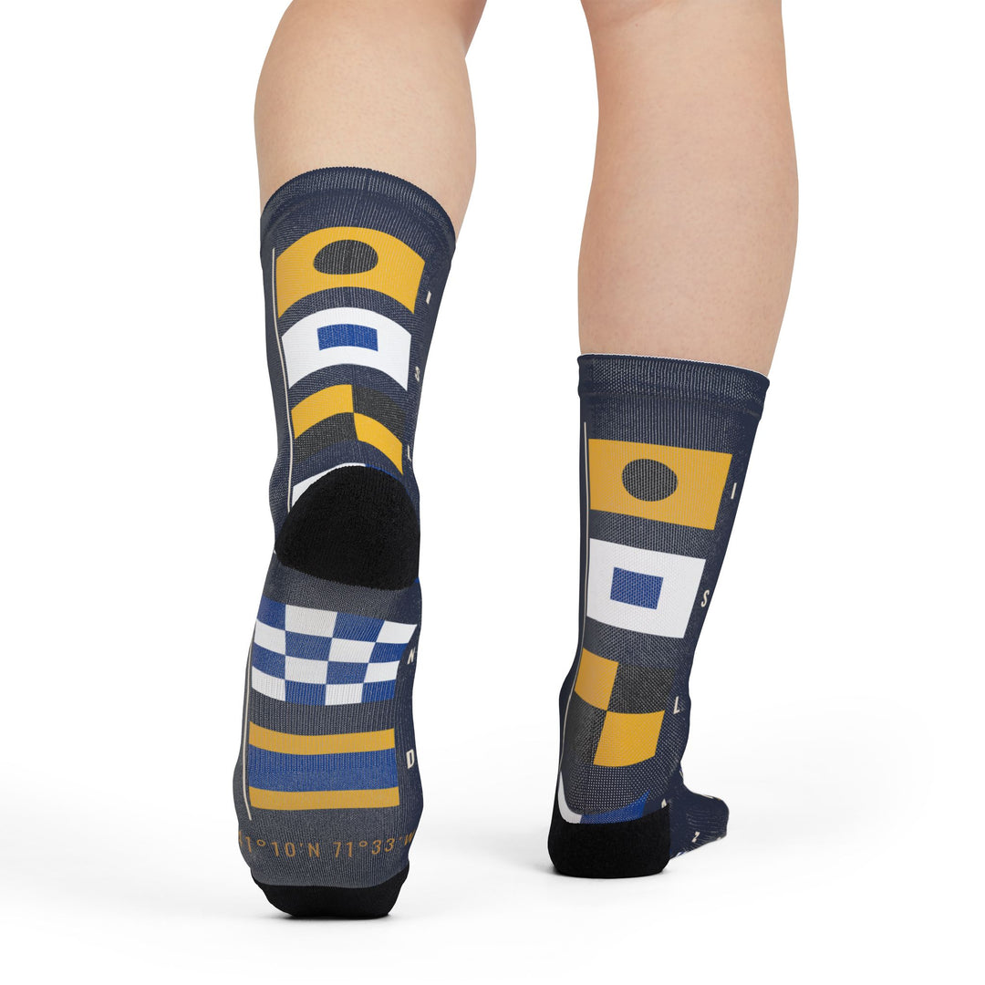 Rear view of a model in Block Island signal flag nautical crew socks, flags running down the back of each leg