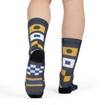 Rear view of a model in Block Island signal flag nautical crew socks, flags running down the back of each leg