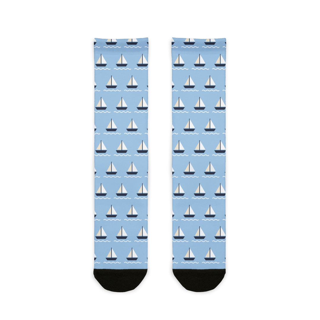 BlockBoundRI Sailboat Regatta socks flat lay, light blue nautical crew socks with rows of white sailboats