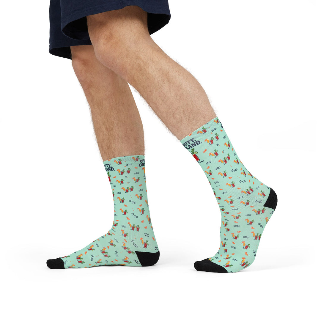 Model mid-stride in denim shorts wearing mint green Block Island socks with cocktails and orange slices