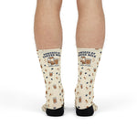Front view of standing model in cream Powered by Coffee Milk Rhode Island socks with milk carton cuff graphic
