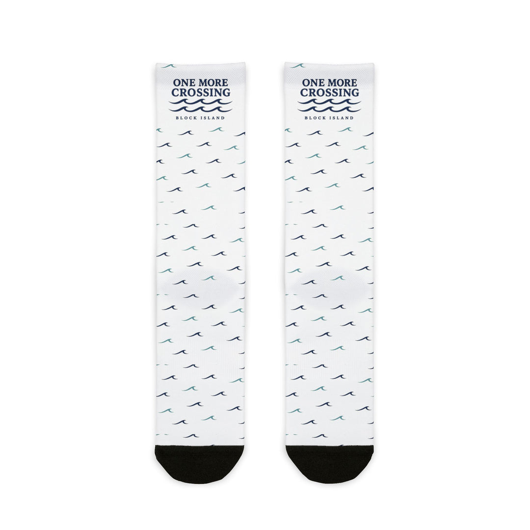 One More Crossing Block Island socks flat lay front, white with navy wave logo and navy and teal wave pattern