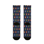 Back of navy Nice Buoys crew socks showing the multicolor lobster buoy pattern and black heels, flat lay