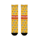 BlockBoundRI Swear Like a Sailor funny beach socks, yellow with grawlix #@!% speech bubbles and ship wheels, flat lay