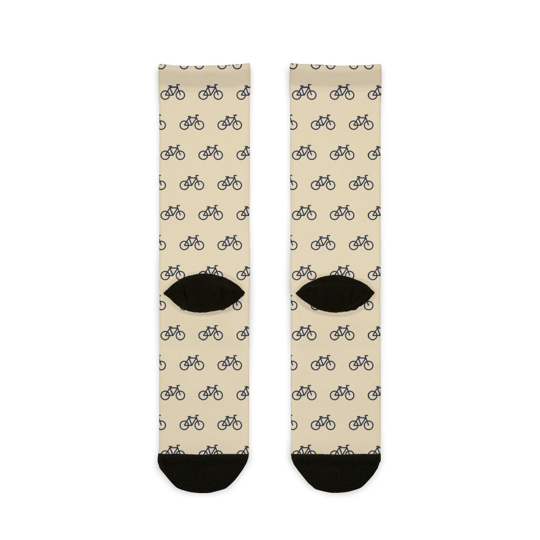Back of My Legs Biked the Bluffs socks laid flat, cream with a repeating bicycle pattern and black heels