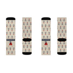 Two tan pairs of Nautical But Nice nautical crew socks laid flat, front banner and heart, back black heels