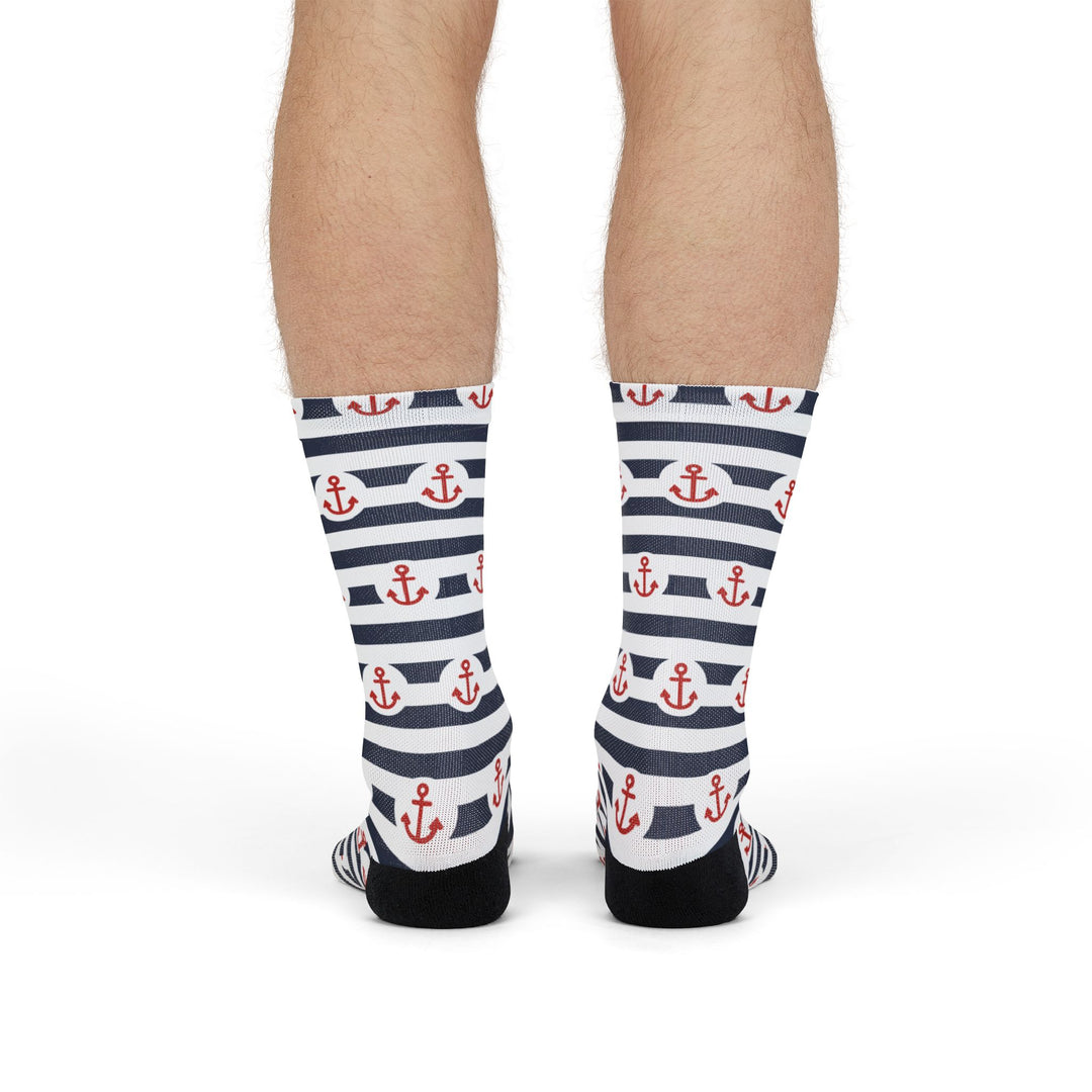 Standing back view of the black heels on navy and white First Mate anchor stripe socks, a Block Island gift
