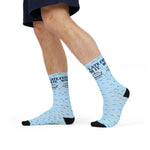 Side view of Ferry Late. Worth It. Block Island socks mid-stride on a model wearing navy shorts