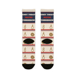 Back flat lay of Knot Today socks showing black heels, coiled rope and knot motifs with red and navy stripes