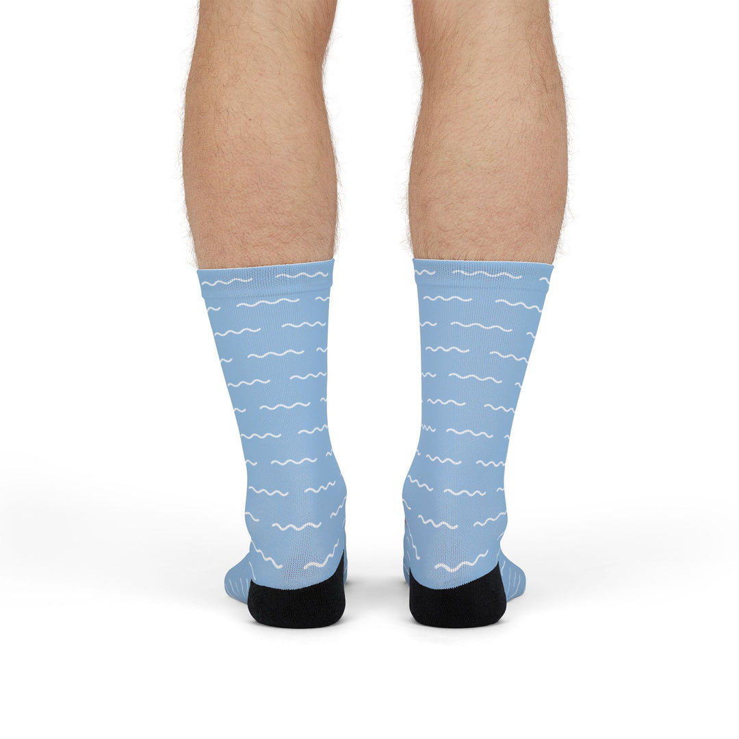 Model standing in light blue Block Island gift socks showing the white dash pattern on the calves