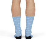 Model standing in light blue Block Island gift socks showing the white dash pattern on the calves