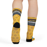 Back view of Squid Pro Quo Rhode Island socks on a model, Official State Appetizer band above black heels