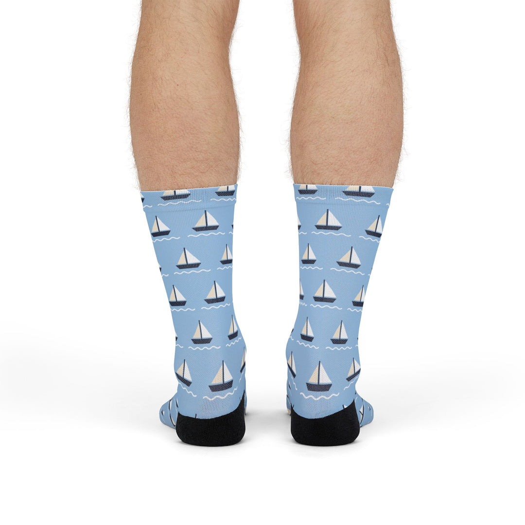 Standing back view of light blue sailboat crew socks with the regatta pattern on both calves
