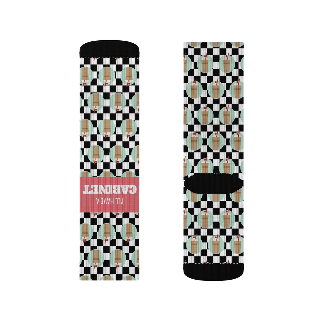 Flat lay pair of Rhode Island coffee cabinet socks, black cuffs and toes framing the I'll Have a Cabinet slogan band