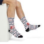 Bare legs resting on a white block showing Hold Fast anchor stripe nautical crew socks with the red slogan panel