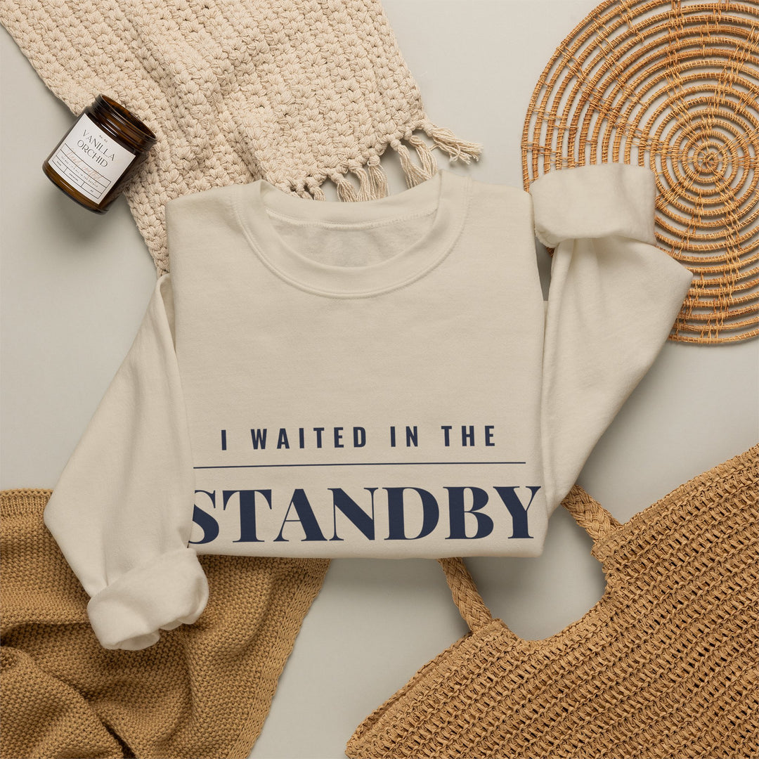 Sand Standby Line Rhode Island crewneck styled flat with a knit blanket and woven basket