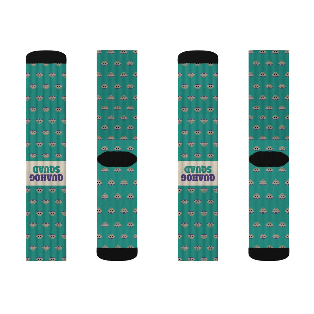 Flat lay of four Quahog Squad Rhode Island socks, fronts and backs, teal clam print with black toes and cream bands