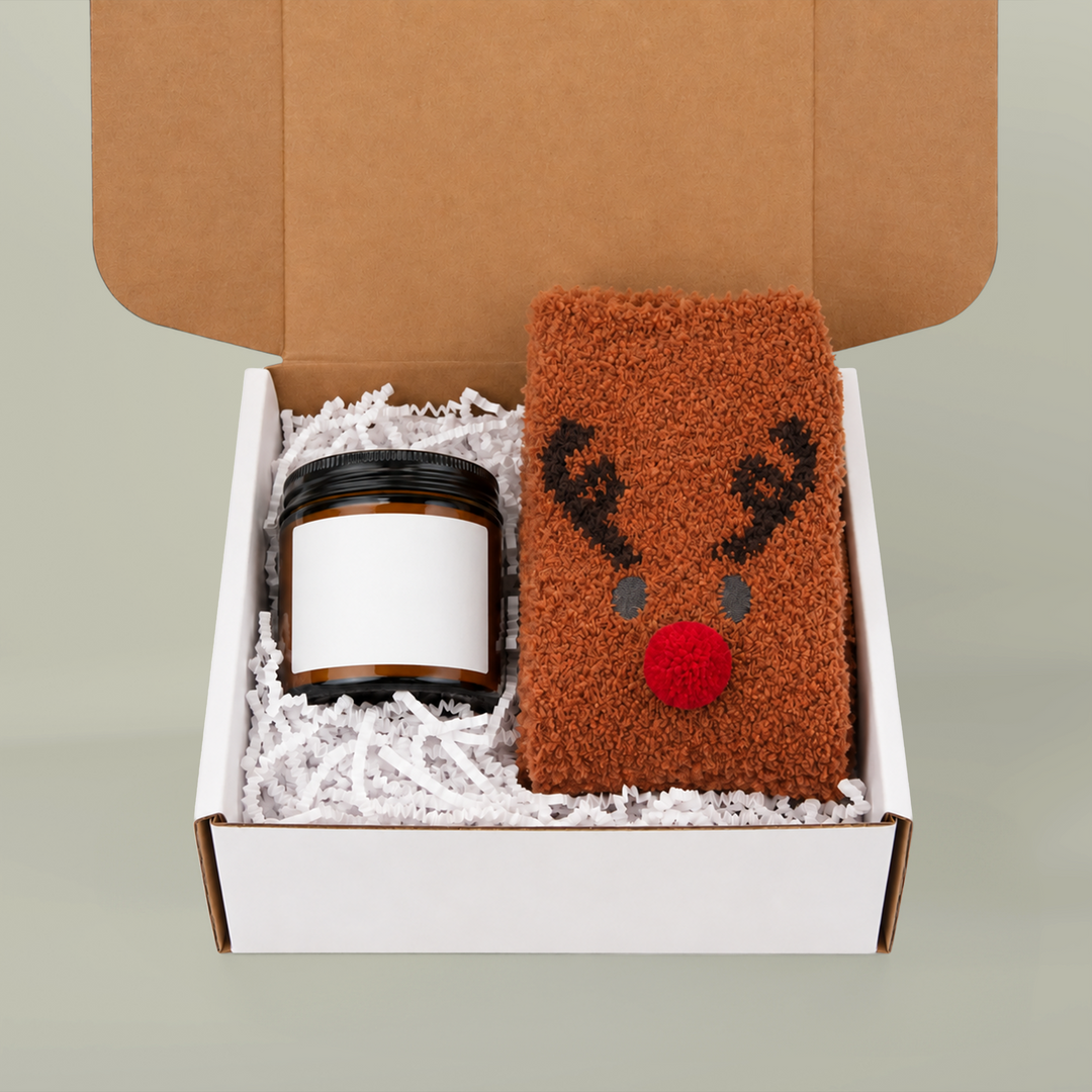 Block Island gift box with amber candle (sample blank label shown) and brown fuzzy reindeer socks
