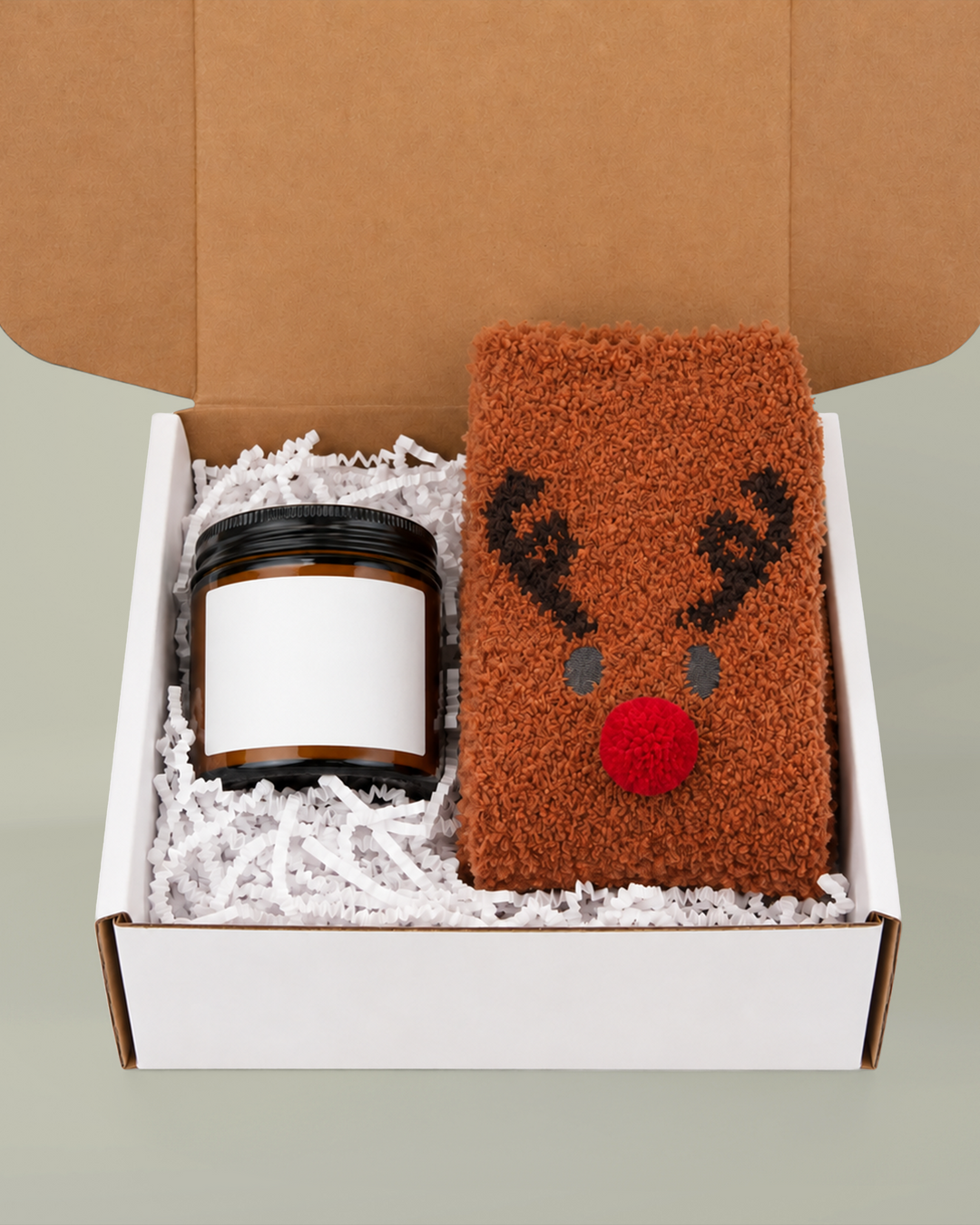 Block Island gift box with amber candle (sample blank label shown) and brown fuzzy reindeer socks