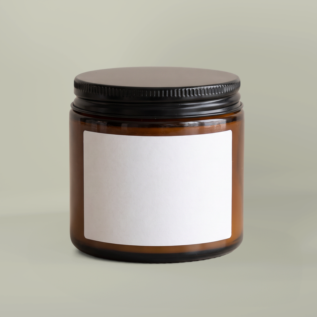 Amber glass candle jar with blank sample label; yours carries the Home for the Holidays Block Island gift label