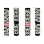 Second flat lay of four checkered I'll Have a Cabinet Rhode Island socks in a row, two showing the coral slogan band