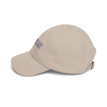 Left side profile of the Stone Block Island dad cap with Crossing Club embroidery and curved bill