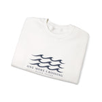 Folded white Rhode Island sweatshirt with navy wave graphic and One More Crossing Block Island text