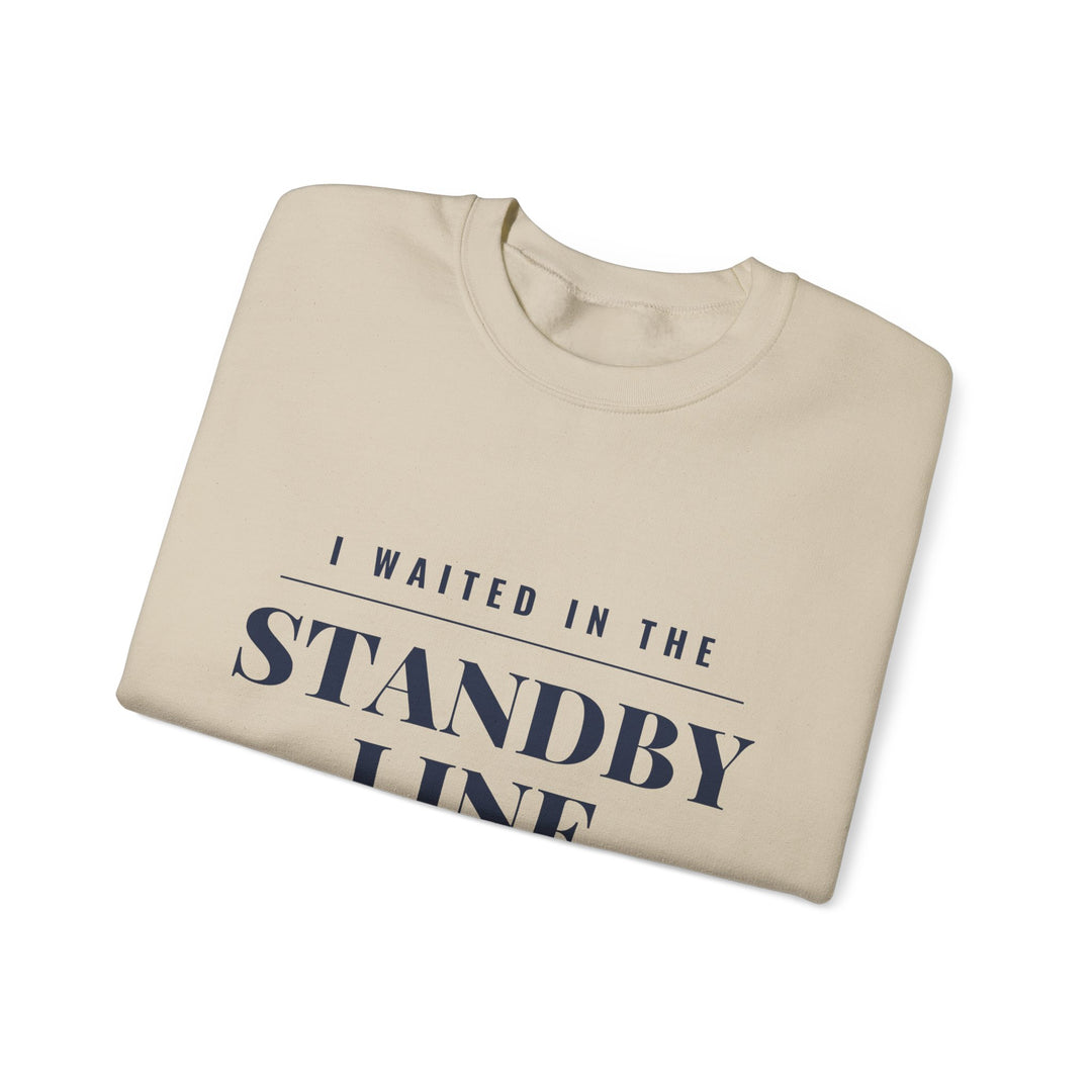 Folded sand Block Island sweatshirt showing the I Waited in the Standby Line black lettering up close