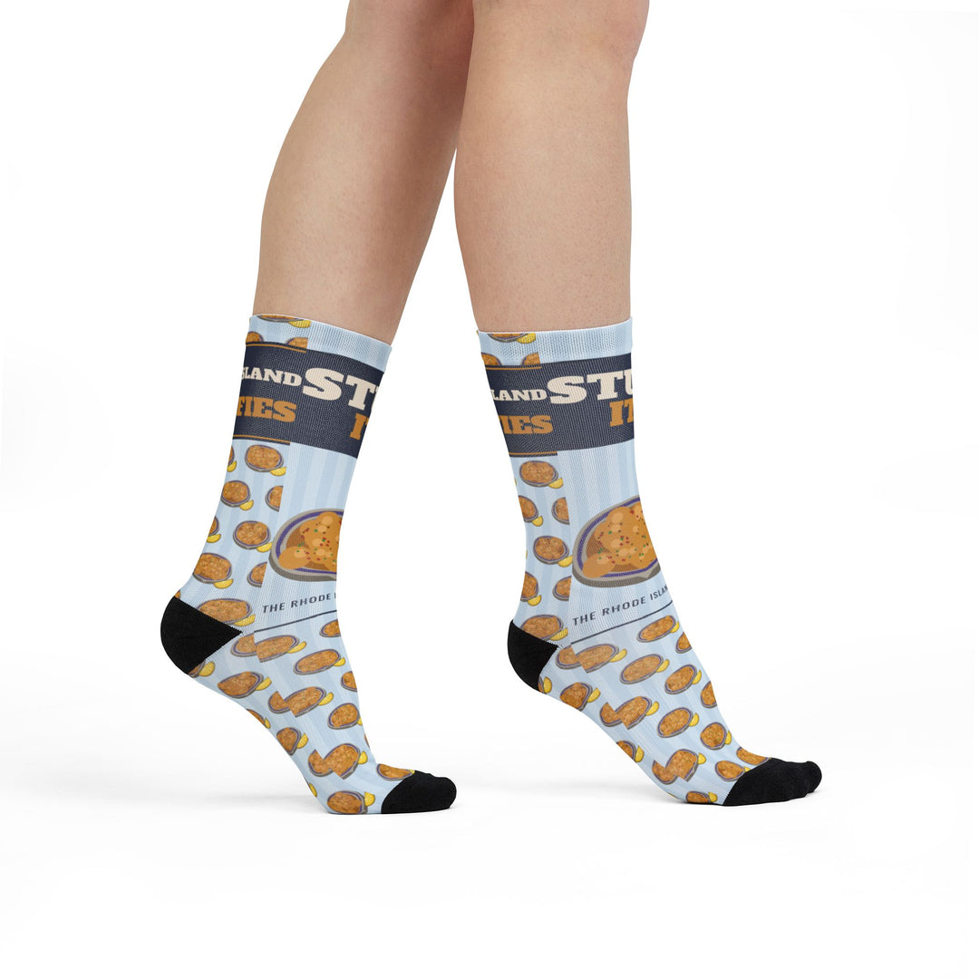 Model standing in light blue Stuff It. Rhode Island socks with a repeating stuffed quahog pattern