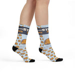 Model standing in light blue Stuff It. Rhode Island socks with a repeating stuffed quahog pattern