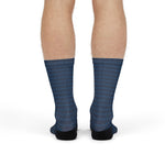 Back view of a model standing in the navy wave Block Island crew socks with sunset striped cuffs