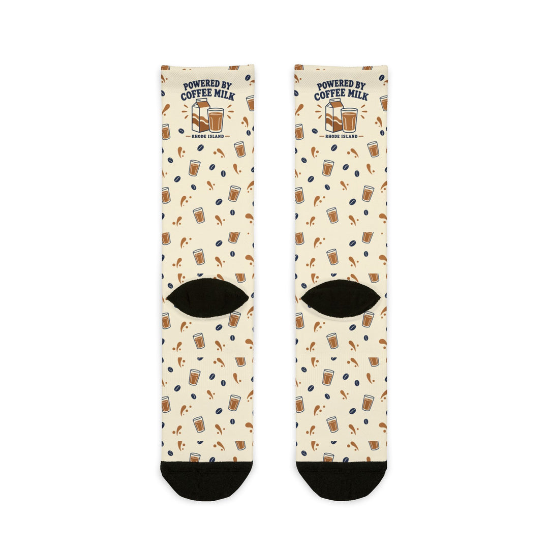 Back flat lay of cream Powered by Coffee Milk Rhode Island crew socks showing black heels and toes