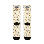 Back flat lay of cream Powered by Coffee Milk Rhode Island crew socks showing black heels and toes