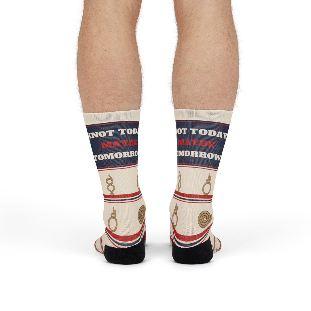 Front view of legs standing in Knot Today nautical crew socks, navy cuff band with red and white lettering