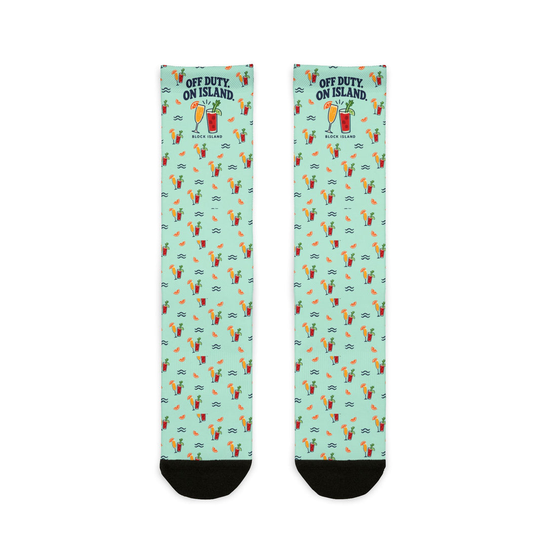 BlockBoundRI Off Duty. On Island. Block Island socks flat lay, mint green with cocktail glasses pattern