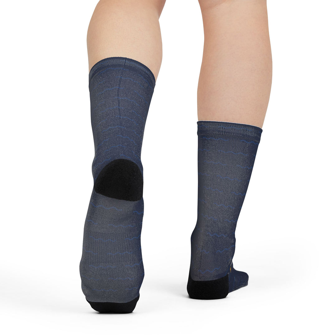 Back view of model standing in solid navy nautical crew socks showing black heels