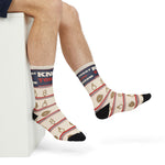 Side view of crossed legs in cream Knot Today nautical crew socks with navy band - a funny sailing gift