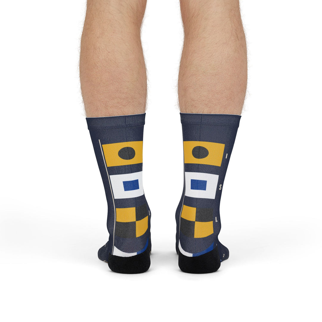 Model standing in Block Island signal flag nautical crew socks, back view with black heels