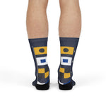 Model standing in Block Island signal flag nautical crew socks, back view with black heels