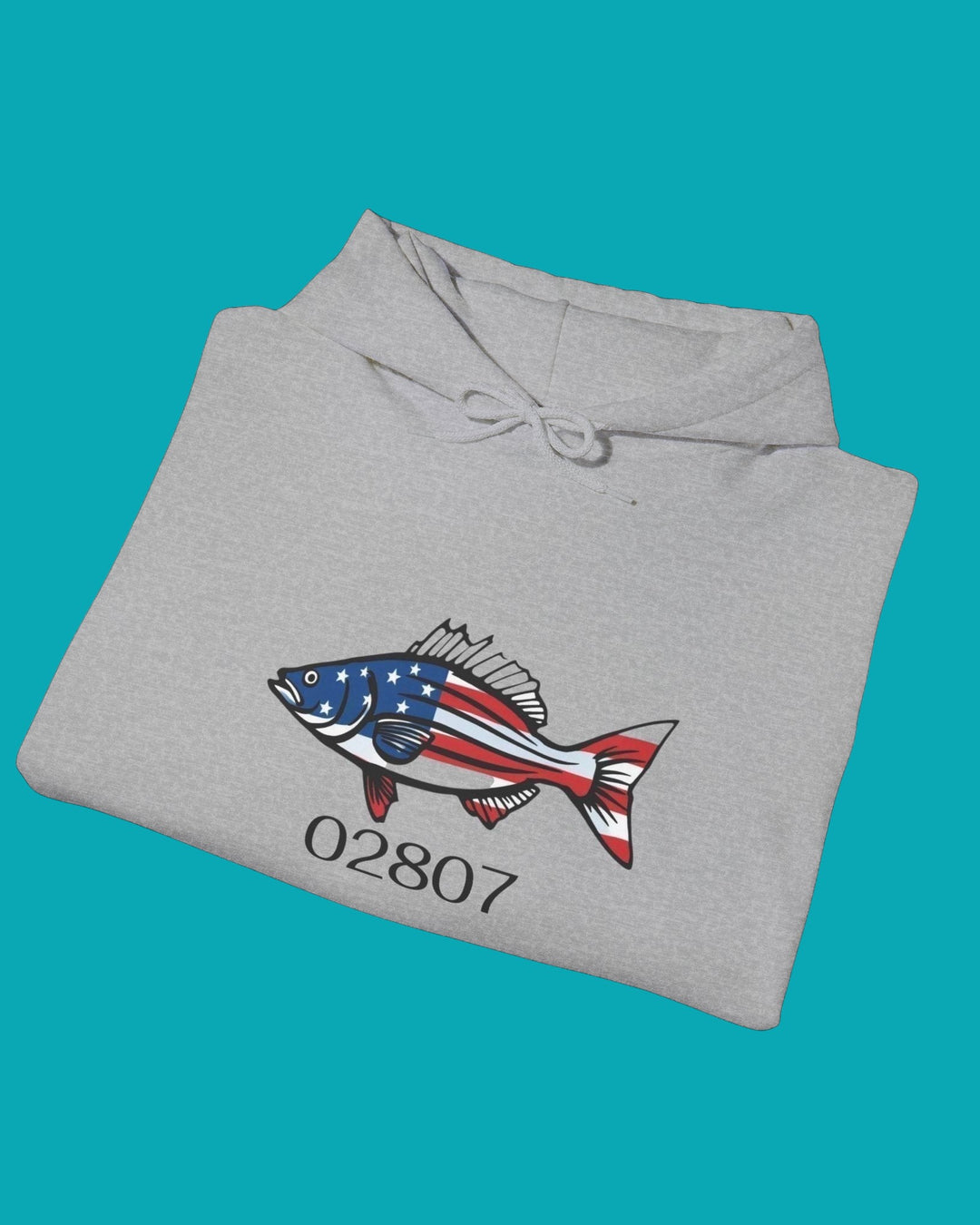 BlockBoundRI heather grey hooded sweatshirt featuring a striped bass graphic with American flag pattern and 02807 text