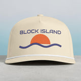 BlockBoundRI cream five-panel cap with retro sunset and wave embroidery and decorative rope trim on the curved bill.