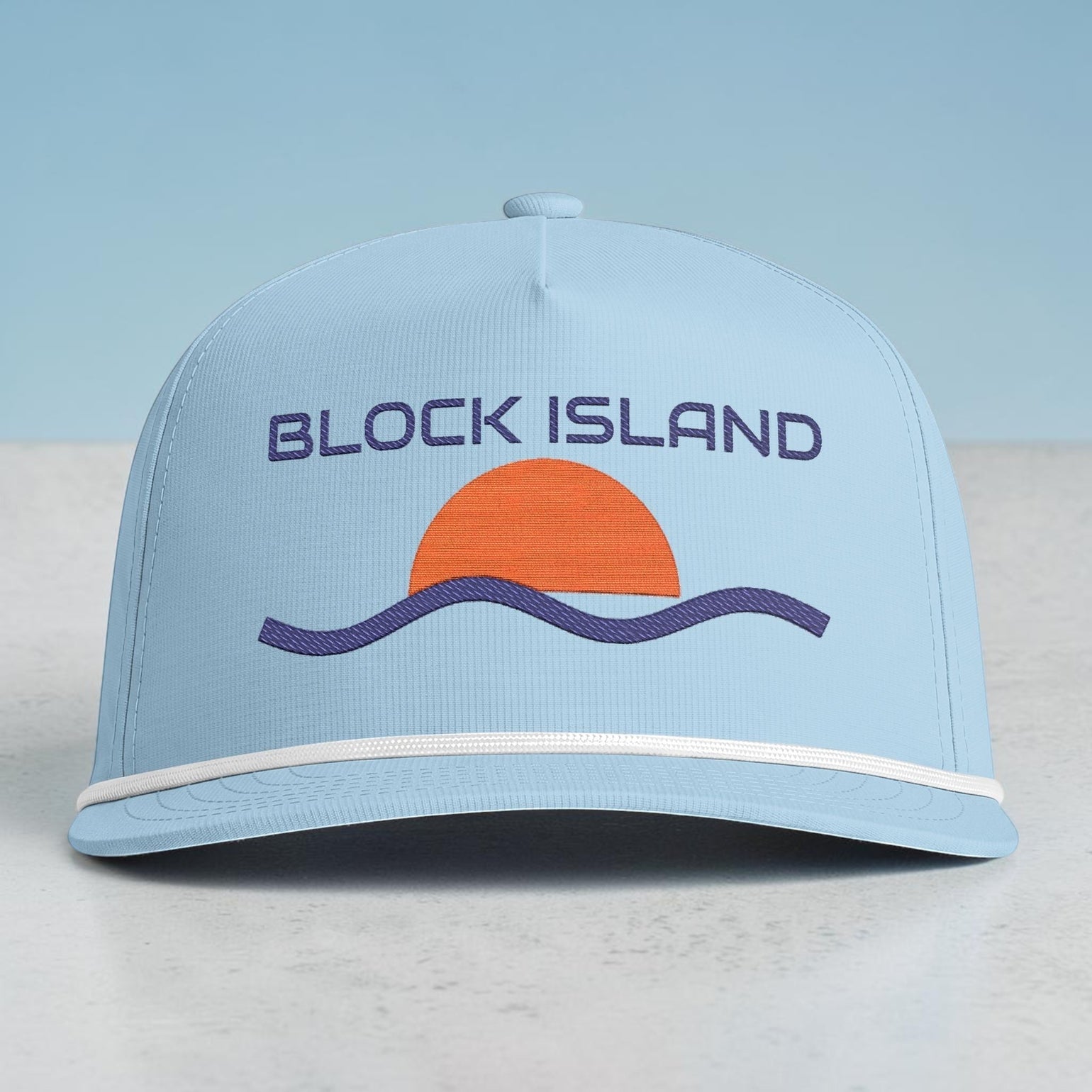BlockBoundRI light blue five-panel cap with a retro sunset and wave embroidery and white rope trim on the curved bill.