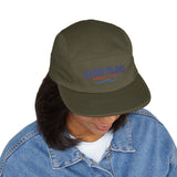 BlockBoundRI olive green 5-panel cotton cap with Block Island Rhode Island embroidery worn by a person in denim